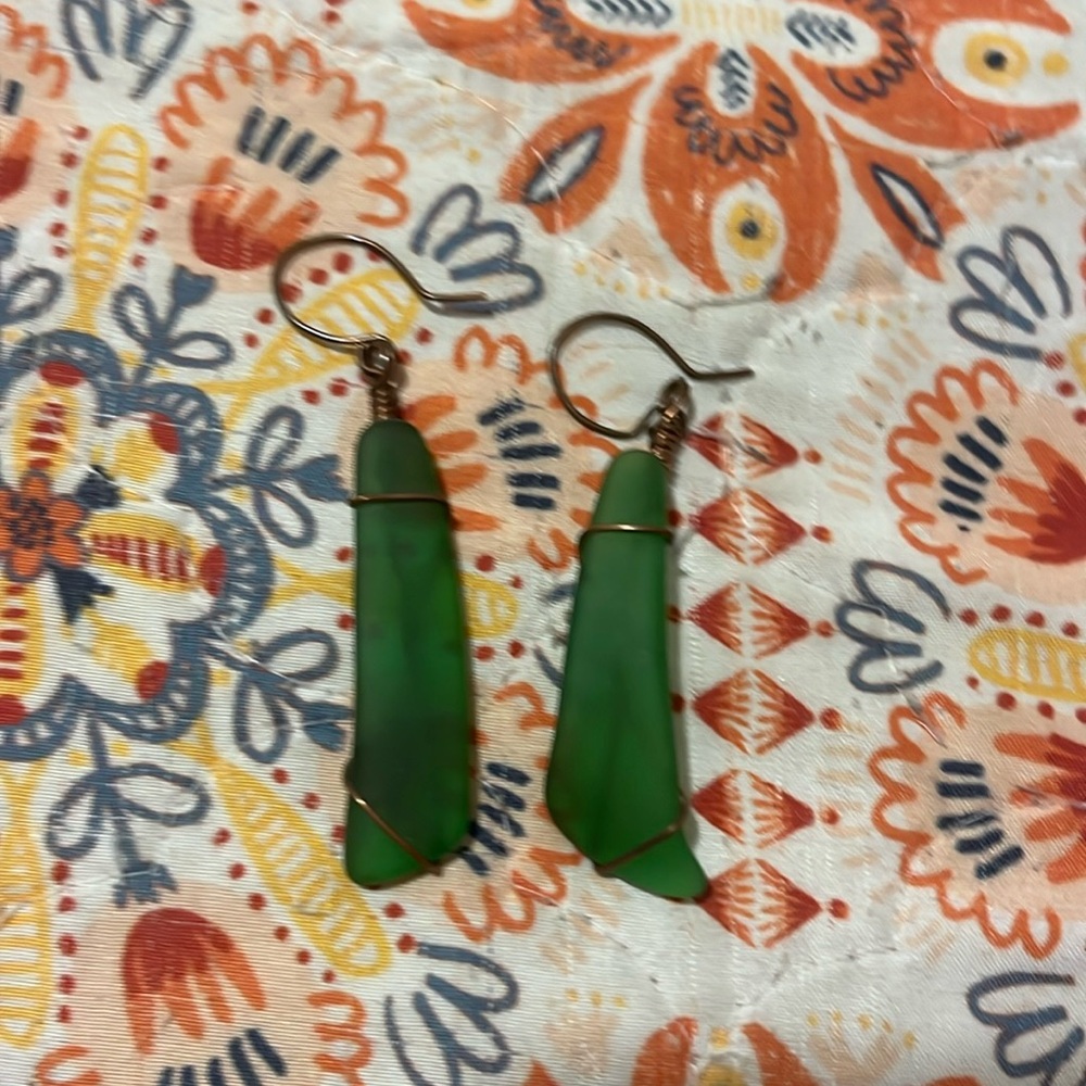 Green sea glass with bronze wrapping ear